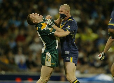 The late Cormac McAnallen on the end of some rough treatment from Australia's Barry Hall during the seconnd test in 2003