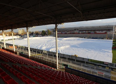 Groundstaff at Ravenhill work against the elements yesterday in preparation for the game against Bath tomorrow.