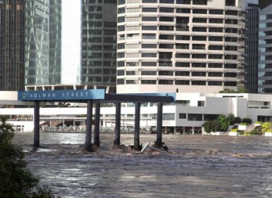 The Holman Street ferry is submerged by water flowing down the Brisbane River in Brisbane, Australia.