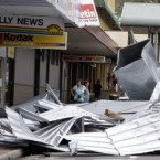 Two women survey the damage in Tully, Australia on 3 February, 2011, after Cyclone Yasi brought heavy rain and howling winds gusting to 186 mph (300 kph). (AP Photo/Rick Rycroft)