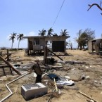 A beach-side house is destroyed in Tully Heads, Australia, 5 February, 2011, after Cyclone Yasi. (AP Photo/Rick Rycroft)