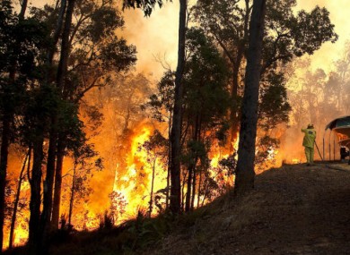 This photo from the Fire and Emergency Services Authority of Western Australia shows a bushfire raging near a home in Roleystone, Perth.