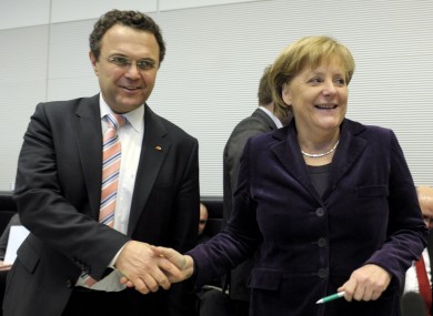 Hans-Peter Friedrich with Angela Merkel in January