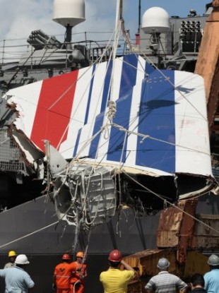 June 14, 2009 file photo: workers unload debris, belonging to crashed Air France flight AF447, from the Brazilian Navy's Constitution Frigate in the port of Recife, northeast of Brazil.