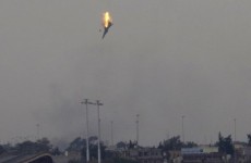 Libyan warplane shot down as Gaddafi forces deny breaching ceasefire