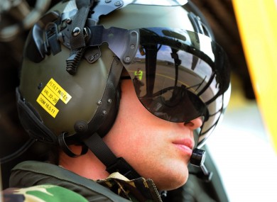 Prince William at the controls of a Sea King helicopter during a training exercise at Holyhead Mountain yesterday.