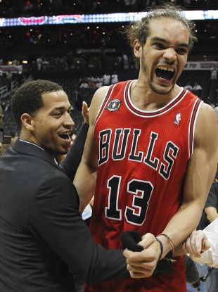 Joakim Noah (right) and Jannero Pargo react to the Bulls' win last night.