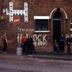 Nationalist youths throw stones on the Falls Road in Belfast on the eve of Bobby Sands' funeral, 1981. Pic: Photocall Ireland