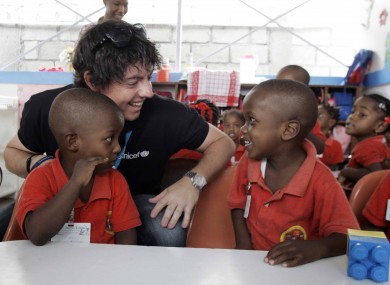McIlroy with pupils at the Unicef-supported Ecole Joyeux Lutins in Port au Prince