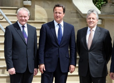 Prime minister David Cameron meets Martin McGuiness (left) and Peter Robinson (right) at Stormont this morning.