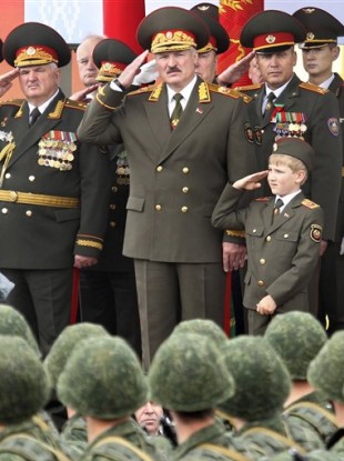 Belarus President Alexander Lukashenko, front centre, with his youngest son Nikolai, right, during a parade marking Independence Day in Minsk today.