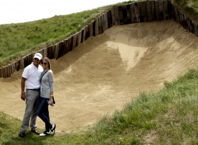 Spanish golfer Pablo Larrazabal poses with his girlfriend Gala by the famous bunker on Royal St George's fourth hole.