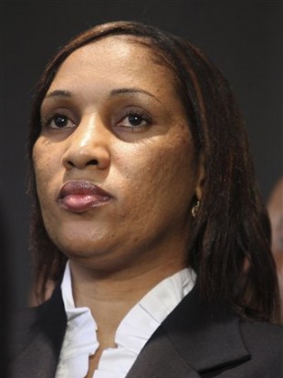 Nafissatou Diallo, who accused former IMF Head Dominique Strauss-Kahn of sexually attacking her, speaks to reporters during a news conference today