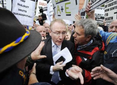 Frank Feighan TD is challenged by protestors against the Roscommon hospital A&E downgrade outside the Dail yesterday