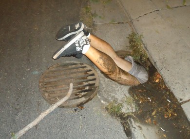 Mr Medeiros in the manhole