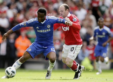 Mikel in action against Wayne Rooney