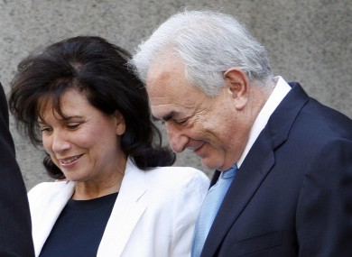 Dominique Strauss-Kahn leaves New York State Supreme court with his wife Anne Sinclair in July. At least some of the charges against him are expected to be dropped tomorrow.