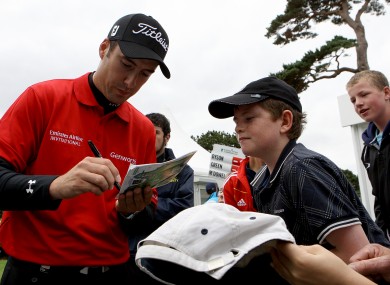 Fisher signing an autograph for a young fan at last month's Irish Open.