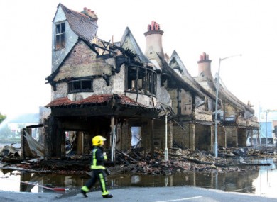The burnt-out remains of the Reeves Furniture story in Croydon this morning.