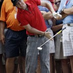 Northern Ireland's Rory McIlroy recoils from making contact with a tree root during the first round of the USPGA Championship. He'd later require medical attention.