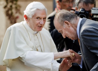 Spain's King Juan Carlos, right, welcomes Pope Benedict XVI before a meeting at the Zarzuela Palace in Madrid.