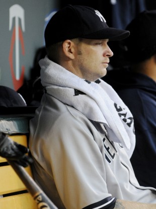 A.J. Burnett, takes in the rest of the second inning from the dugout.