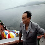 A North Korean man stands on the deck of the North Korean leisure boat the 