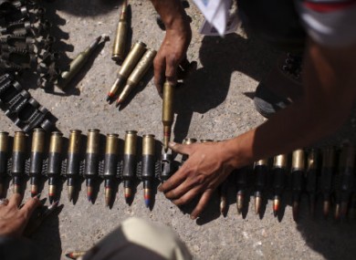 Libyan rebels prepare ammunition between Tarhouna and Bani Walid yesterday.