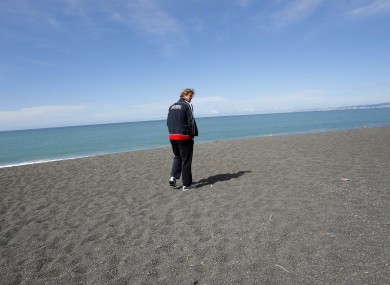 French rugby player Aurelien Rougerie walks along the beach in Napier.