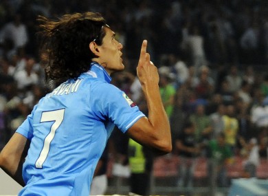 Napoli's Edison Cavani celebrates scoring against Milan.