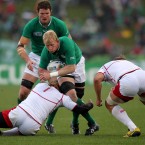 Ireland's Leo Cullen is tackled by Russia's Sergey Popov.