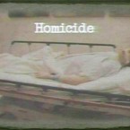 A photograph displayed to jurors in Los Angeles shows Michael Jackson after his death. The word 'Homicide' has been added by the prosecution. (AP)