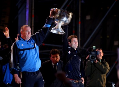 Dublin manager Pat Gilroy and captain Bryan Cullen carry out the Sam Maguire cup on stage.