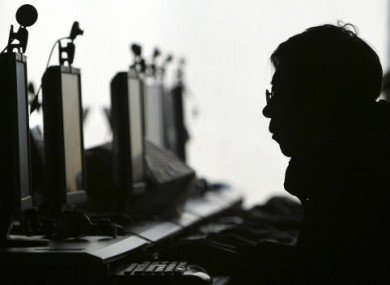 File photo of a row of computer monitors at an Internet cafe