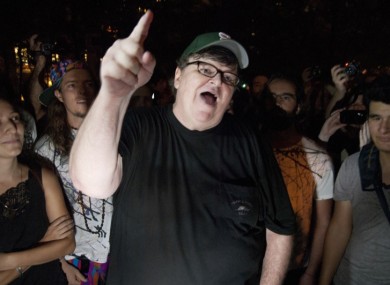 Moore gestures during a visit to the