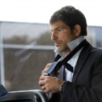 French coach Marc Lievremont adjusts his tie in the team bus before going for a lunch at the French embassy in Wellington.
(AP Photo/Christophe Ena)