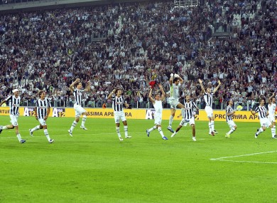 Juventus players celebrate their 2-0 win over AC Milan.