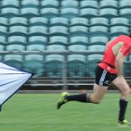 New Zealand's Conrad Smith runs with a parachute during training.
(AP Photo/Ross Land)