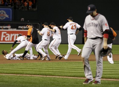 Boston leave the field after the Baltimore Orioles secure their post-season qualification.