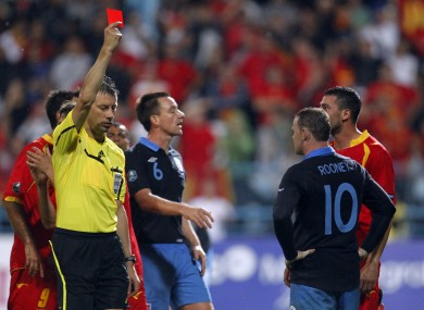 Rooney was penalised for lashing out at Mirodrag Dzudovic.