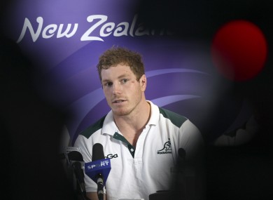 Pocock listens to questions at a press conference.
