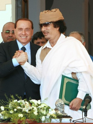 Silvio Berlusconi with Muammar Gaddafi (File photo)