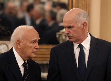 Greek Prime Minister George Papandreou, talking with the President Carolos Papoulias in June 2011