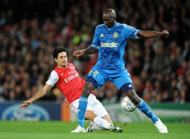 Arsenal's Mikel Arteta (left) and Marseille's Alou Diarra battle for the ball.