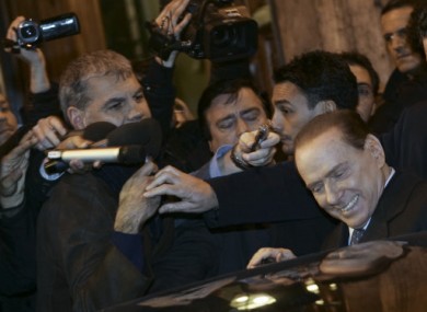 Berlusconi leaves the senate in Rome on Thursday.
