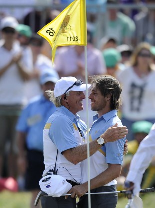 Australia's captain Greg Norman, left, congratulates Aaron Baddeley.