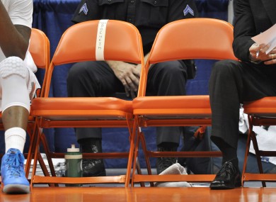 The empty chairs of Syracuse head coach Jim Boeheim and associate head coach Bernie Fine during a game last weekend.