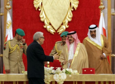 Investigator Cherif Bassiouni, in black, presents his report to Bahrain's king today.