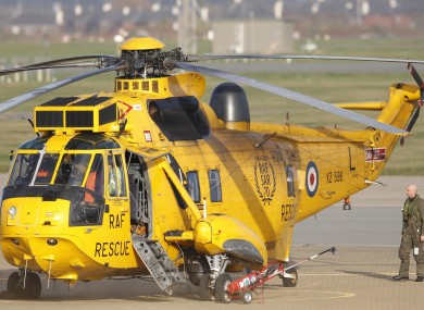 A Westland Sea King search and rescue helicopter sits on the ground at RAF Valley during an operation to rescue survivors from a ship which sank after being hit by an enormous wave in the Irish Sea.