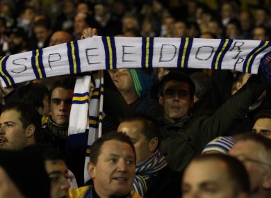 Leeds United fans hold up a scalf in memory of Gary Speed last night at the City Ground.